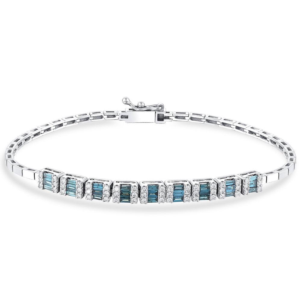 Silver tennis bracelet with deep blue baguette stones and clear accent gems